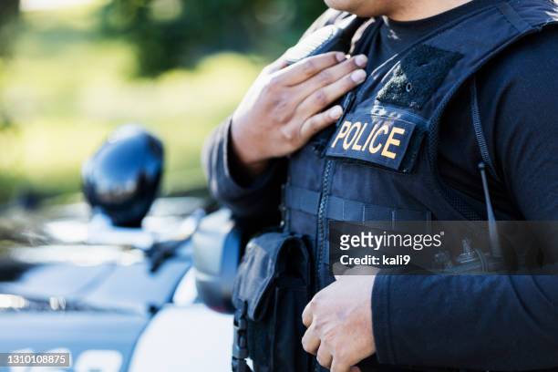 cropped view of police officer - cop car imagens e fotografias de stock