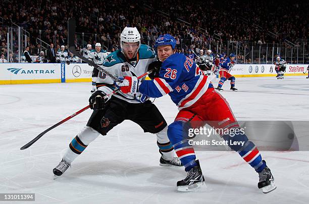 Ruslan Fedotenko of the New York Rangers skates in the third period against Jason Demers of the San Jose Sharks at Madison Square Garden on October...