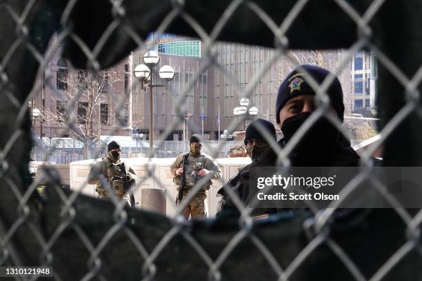 National Guard soldiers and police keep watch at a security checkpoint outside of the Hennepin County Government Center during the trial of former...