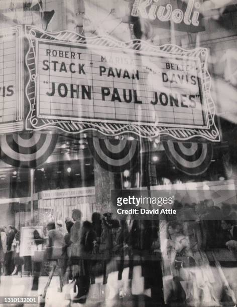 Photo montage of crowds lined up at the Rivoli Theater at 1620 Broadway to see a sold-out showing of the movie "John Paul Jones," starring Bette...