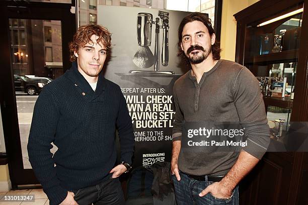 The NHL's Anaheim Ducks teammates Jonas Hiller and George Parros arrive at the Anaheim Ducks Movember Kick-Off event at The Art Of Shaving on October...