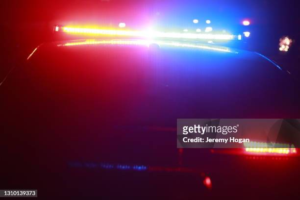 police car with led lights at a crime scene - police lights stock pictures, royalty-free photos & images