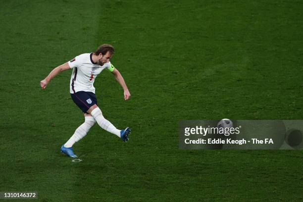 Harry Kane of England scores their side's first goal from the penalty spot during the FIFA World Cup 2022 Qatar qualifying match between England and...