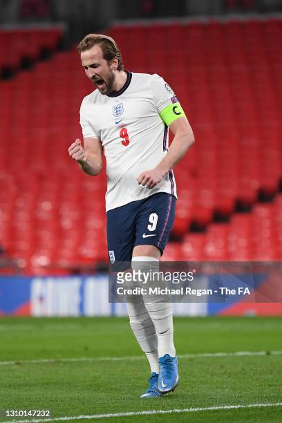 Harry Kane of England celebrates after scoring their side's first goal from the penalty spot during the FIFA World Cup 2022 Qatar qualifying match...
