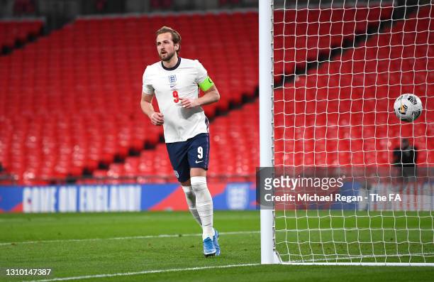 Harry Kane of England celebrates after scoring their side's first goal from the penalty spot during the FIFA World Cup 2022 Qatar qualifying match...