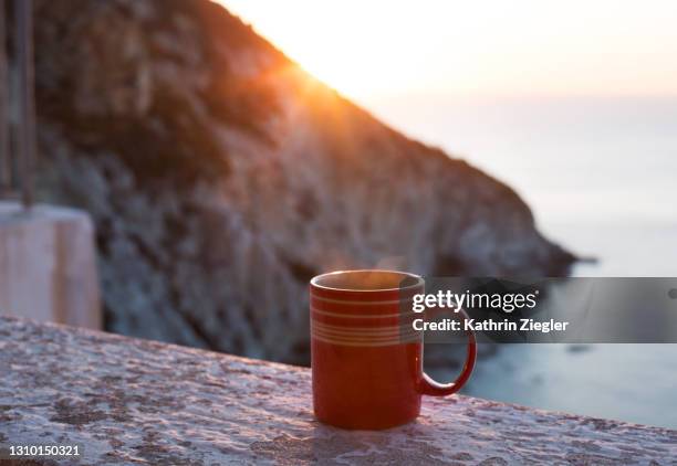 a cup of coffee at sunrise - sea cup stock pictures, royalty-free photos & images