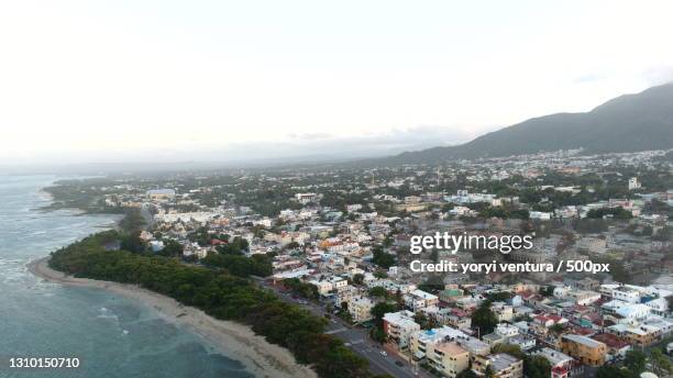 aerial view of townscape by sea against sky,puerto plata,dominican republic - puerto plata imagens e fotografias de stock