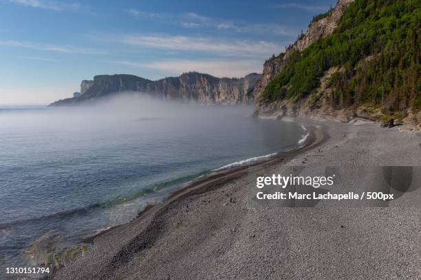 scenic view of beach against sky,forillon national park,quebec,canada - forillon national park stock pictures, royalty-free photos & images