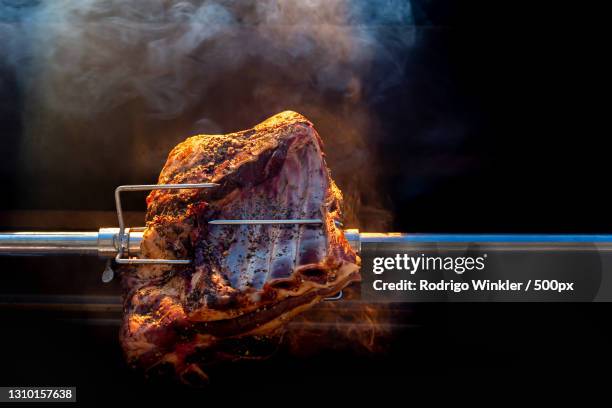 close-up of meat on barbecue grill - spit stock pictures, royalty-free photos & images