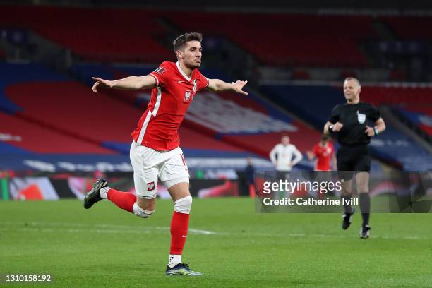 Jakub Moder of Poland celebrates after scoring their side's first goal during the FIFA World Cup 2022 Qatar qualifying match between England and...