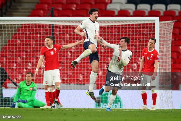 Harry Maguire of England celebrates with Mason Mount after scoring their side's second goal during the FIFA World Cup 2022 Qatar qualifying match...