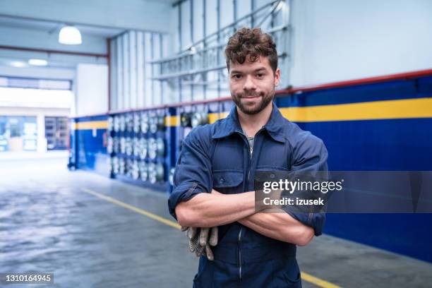 portrait of young car mechanic - mechanic uniform stock pictures, royalty-free photos & images