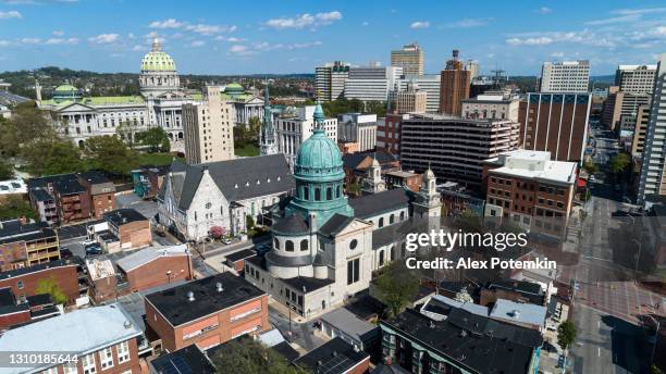 aerial view of the state capitol and the saint patrick cathedral in harrisburg, pennsylvania. - pennsylvania stock pictures, royalty-free photos & images