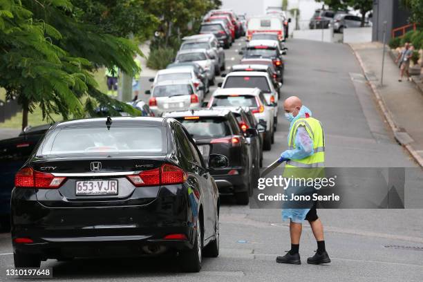 People line up at a drive-in Covid testing center in Bowen Hills on April 01, 2021 in Brisbane, Australia. The Greater Brisbane lockdown will be...