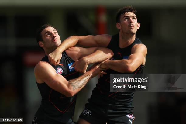 Jeremy Finlayson and Zach Sproule compete during a GWS Giants AFL training session at Tom Wills Oval on April 01, 2021 in Sydney, Australia.
