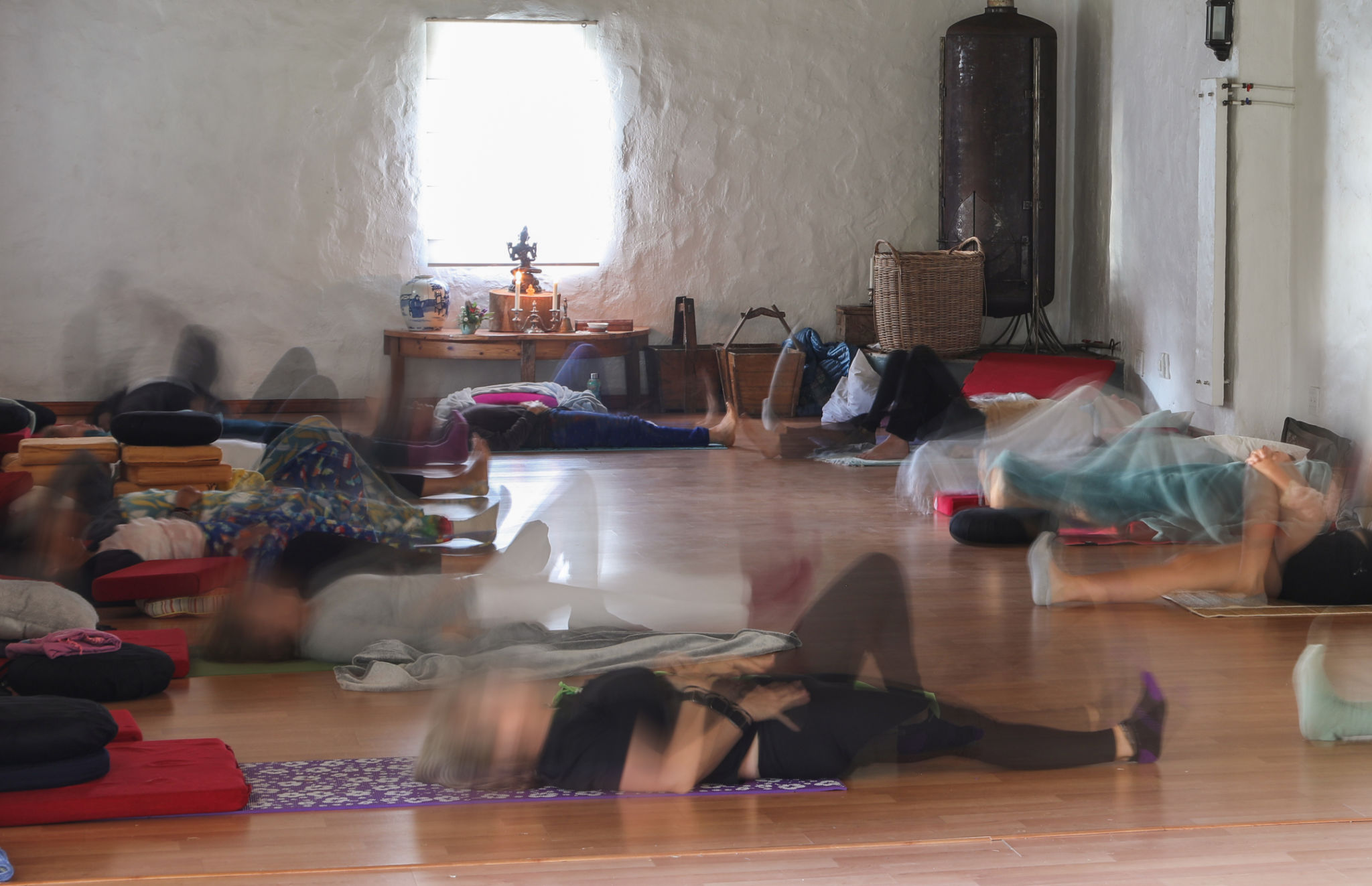 Unrecognizable people preparing for a group meditation session at a mindfulness retreat near Cape Town, South Africa. Unrecognizable people preparing for a group meditation session at a mindfulness retreat near Cape Town, South Africa.