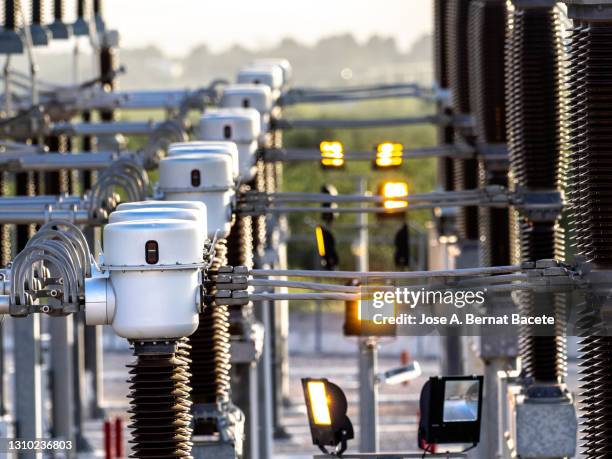 close-up of details of electrical components in a high voltage power station. - hoogspanningstransformator stockfoto's en -beelden
