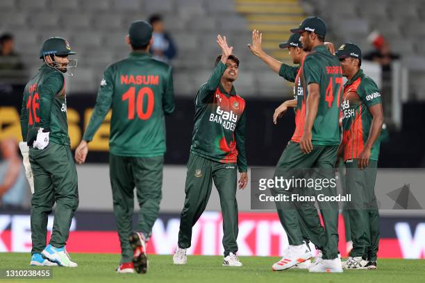 Bangladesh celebrate taking the wicket of Martin Guptill of New Zealand during game three of the International T20 series between New Zealand and...