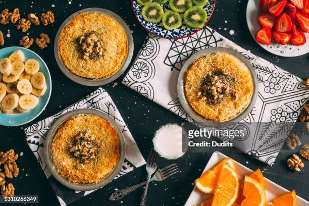 flat lay traditional turkish dessert künefe - template:east stock pictures, royalty-free photos & images