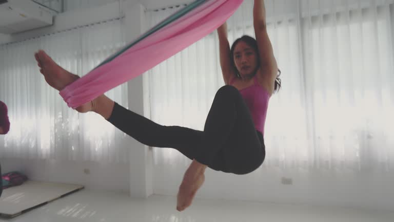 https://media.gettyimages.com/id/1310268425/video/aerial-yoga-good-posture.jpg?b=1&s=640x640&k=20&c=1VE-M-vVmmPDAUXkienYSqh0NQZ_vi0vHrh8SMnFq8Y=