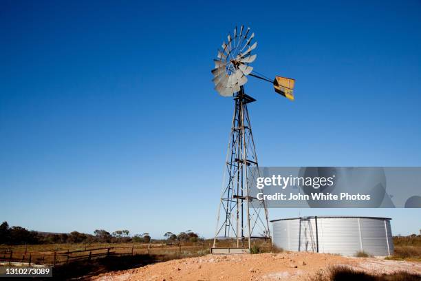 windmill and tank. gawler ranges south australia - outback windmill stock pictures, royalty-free photos & images