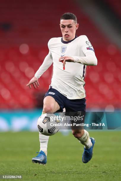 Phil Foden of England runs with the ball during the FIFA World Cup 2022 Qatar qualifying match between England and Poland on March 31, 2021 at...