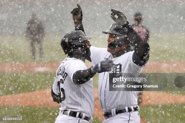 Miguel Cabrera of the Detroit Tigers celebrates his first inning two run home run with Jeimer Candelario of the Detroit Tigers while playing the...