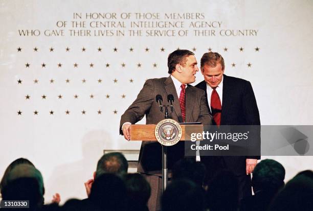 Director of the Central Intelligence Agency, George Tenet speaks with President George W. Bush March 20, 2001 at the CIA Headquarters in Langley,...