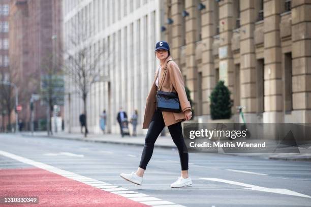 Fashion blogger Patricia Wirschke is seen wearing Ivy and Oak Caban caramel jacket, Ivy & Oak white rip shirt, Closed skinny pusher jeans, Santoni...