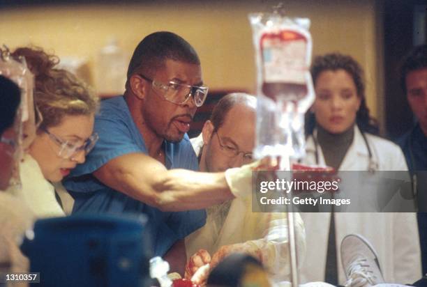 Eriq La Salle as and Michael Michele as act in a scene from "ER" .