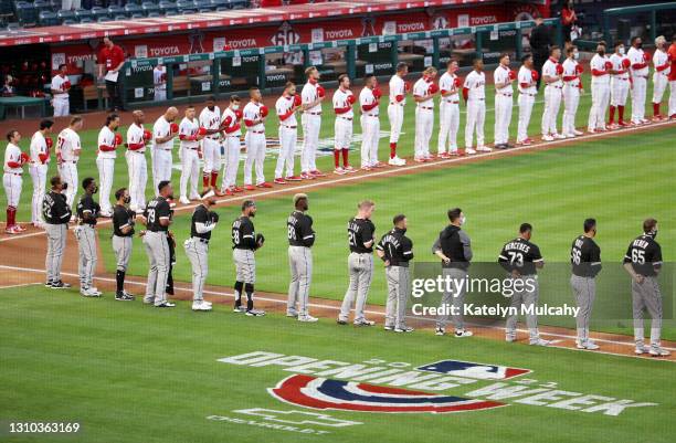 The Los Angeles Angels and Chicago White Sox stand for the national anthem before the game on Opening Day at Angel Stadium of Anaheim on April 01,...