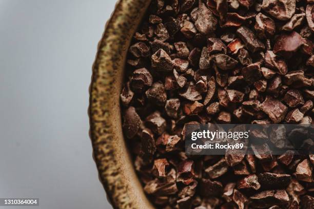 detail shot of cocoa nibs – raw food - cacao fruit stock pictures, royalty-free photos & images