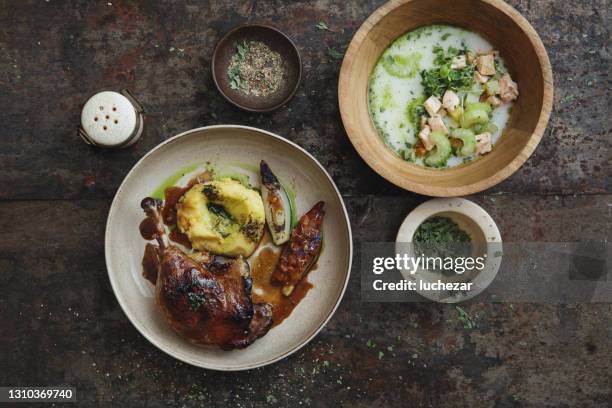 slow cooker duck leg confit and salmon soup - confit stock pictures, royalty-free photos & images