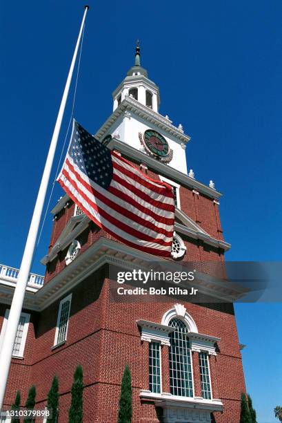 An American Flag flies at half-staff outside an exact replica of Independence Hall at Knott's Berry Farm, September 12, 2001 in Buena Park,...