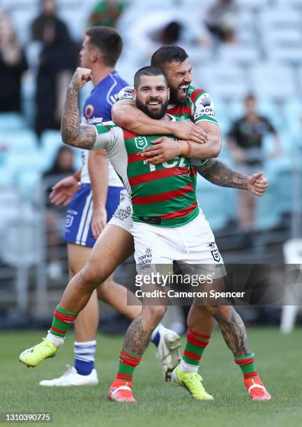 Adam Reynolds of the Rabbitohs celebrates scoring a try with Josh Mansour of the Rabbitohs during the round four NRL match between the Canterbury...