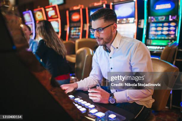 Slot Machine Player Casino Gaming Room Photos and Premium High Res Pictures - Getty Images
