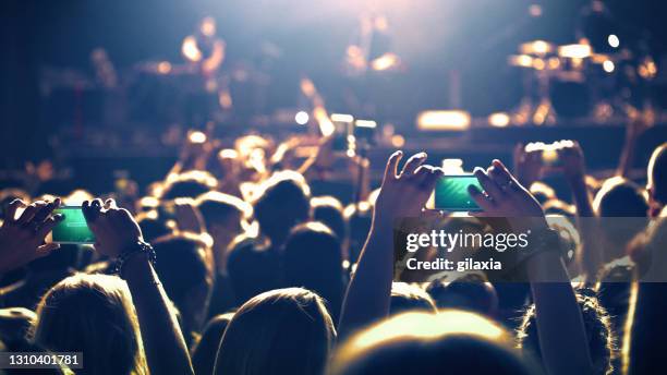 large group of people at a concert party. - clapping hands close up stock pictures, royalty-free photos & images