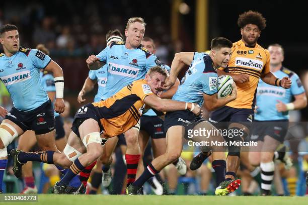 Jack Maddocks of the Waratahs Is tackled during the round 7 Super RugbyAU match between the NSW Waratahs and the ATC Brumbies at Sydney Cricket...