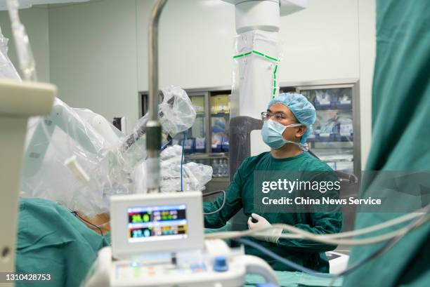 Surgeon performs a minimally invasive surgery with the assistance of the Da Vinci surgical robot at the General Hospital of Ningxia Medical...