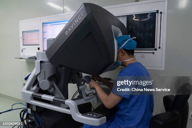 Surgeon performs a minimally invasive surgery with the assistance of the Da Vinci surgical robot at the General Hospital of Ningxia Medical...