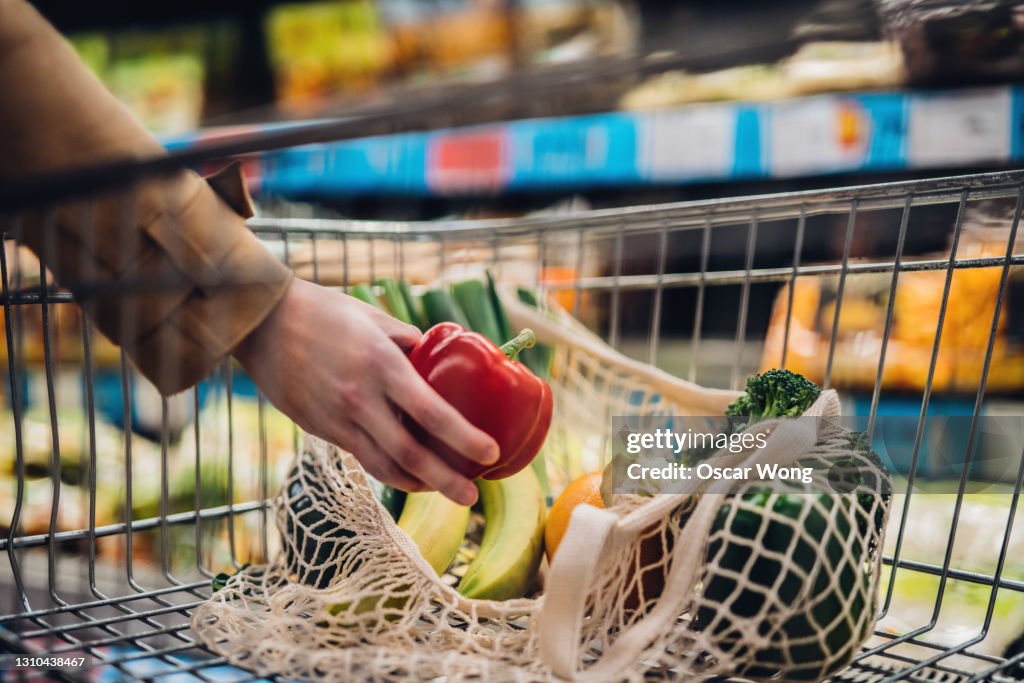 Grocery Shopping With Reusable Shopping Bag At Supermarket