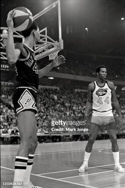 January 23, 1976: George Gervin of the San Antonio Spurs prepares to throw an in-bounds pass while Denver Nuggets guard Ralph Simpson plays defense...