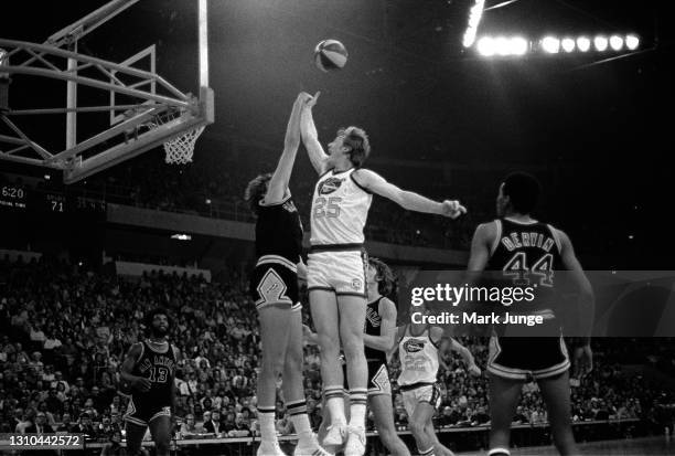 Dan Issel of the Denver Nuggets attempts a layup over Billy Paultz during an ABA game against the San Antonio Spurs at McNichols Arena on January 23,...