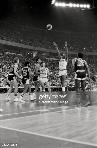 Ralph Simpson of the Denver Nuggets shoots a jumper from the free throw line during an ABA game against the San Antonio Spurs at McNichols Arena on...