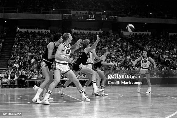 January 23, 1976: Denver Nuggets guard Monte Towe throws a pass to teammate Dan Issel during an ABA game against the San Antonio Spurs at McNichols...