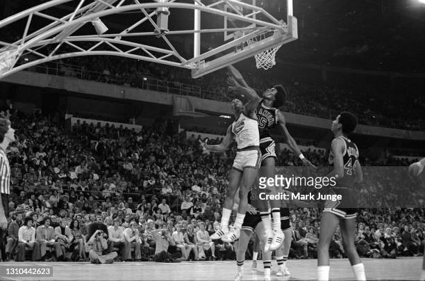January 23, 1976: San Antonio Spurs forward Larry Kenon blocks a layup by guard Jimmy Foster during an ABA game against the Denver Nuggets at...
