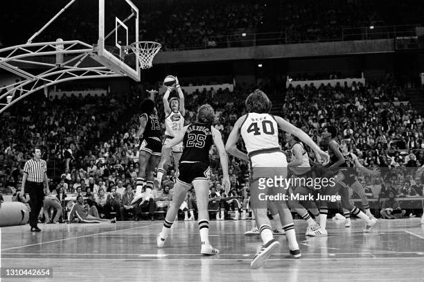 January 23, 1976: Denver Nuggets guard Claude Terry shoots a jumper over James Silas during an ABA game against the San Antonio Spurs at McNichols...