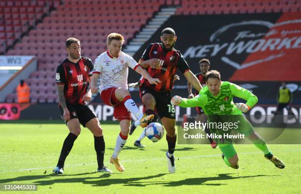 Duncan Watmore of Middlesbrough is challenged by Steve Cook, Cameron Carter-Vickers and Asmir Begovic of AFC Bournemouth during the Sky Bet...