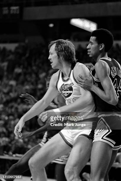 San Antonio Spurs guard George Gervin guards Byron Beck near the basket during an ABA game against the Denver Nuggets at McNichols Arena on January...