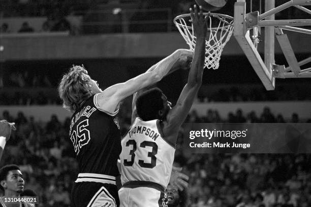 San Antonio Spurs center Coby Dietrick attempts to block a layup by David Thompson as George Gervin watches during an ABA game against the Denver...